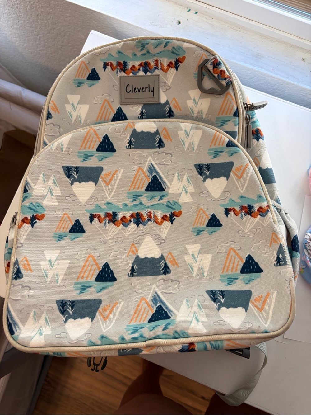 Jansport Kids Backpack in Light Gray with Blue and Orange Mountain Print